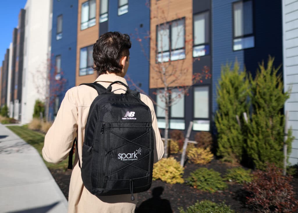 Man wearing branded backpack